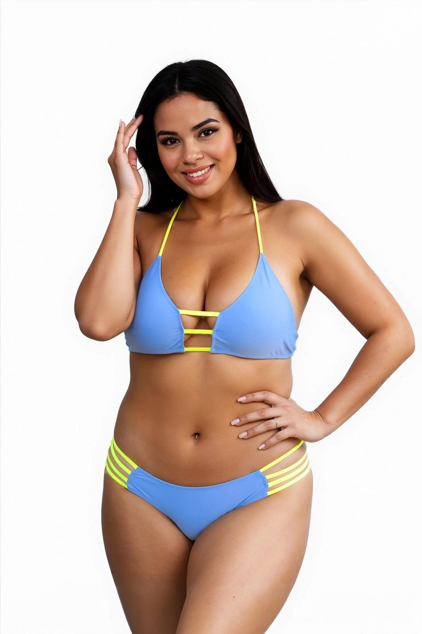 Woman smiles and poses in the Oasis Bikini Top – Sexy Tropical Swimwear by Brigitewear International, LLC, against a plain white background.