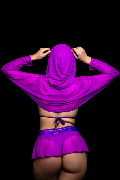 Model in the Brigitewear International, LLC Grape Babe Flirt Skirt-Sexy Swim Skirt Cover Up, purple hooded top and skirt, faces away while adjusting the hood against a black background.