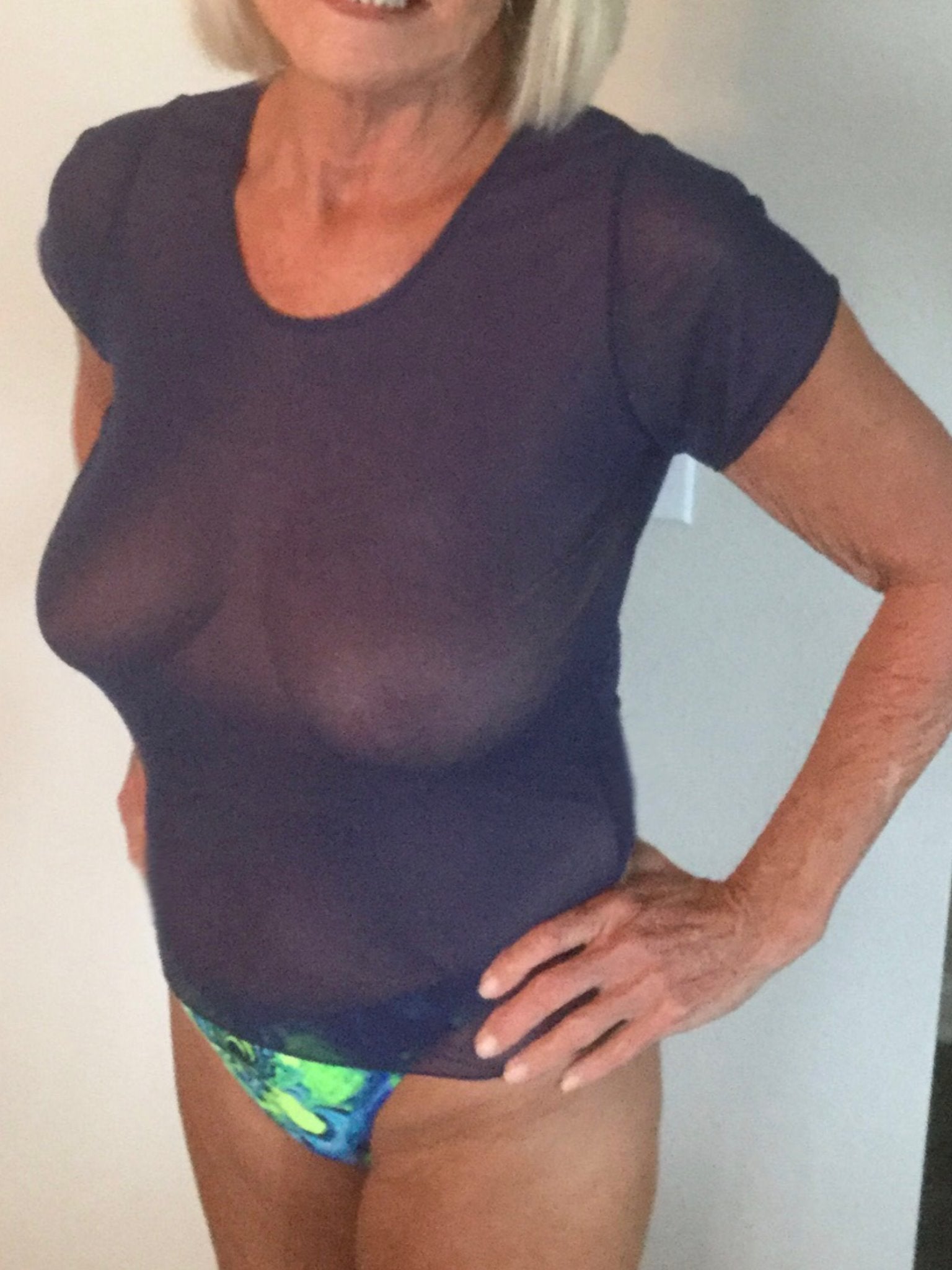 A woman wearing a purple shirt.