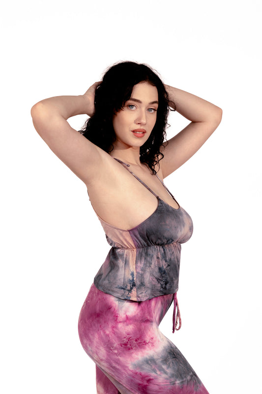 A woman with curly dark hair models the Brigitewear International, LLC Long Loungewear Top-Soft & Cozy, posing with hands behind her head against a white background.