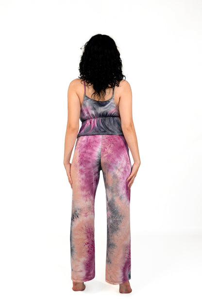 Woman with curly hair stands barefoot, facing away, wearing the Brigitewear International Long Loungewear Top-Soft & Cozy.