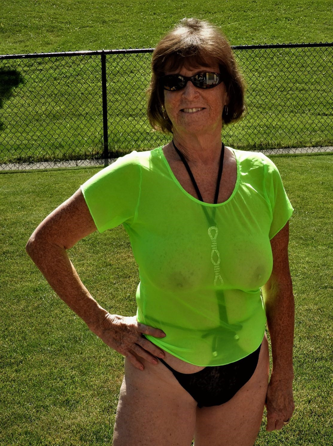A woman in a green shirt.