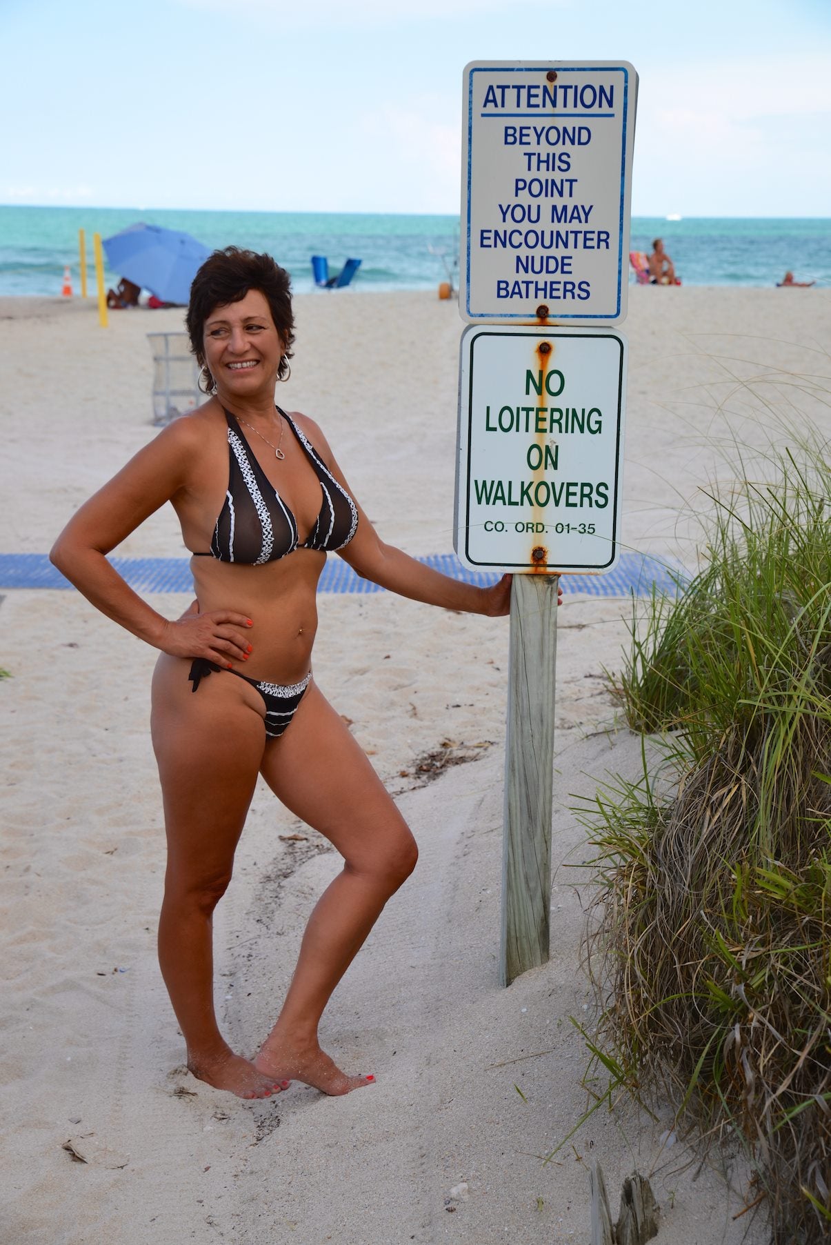 Woman wearing a red bikini swimsuit on the beach