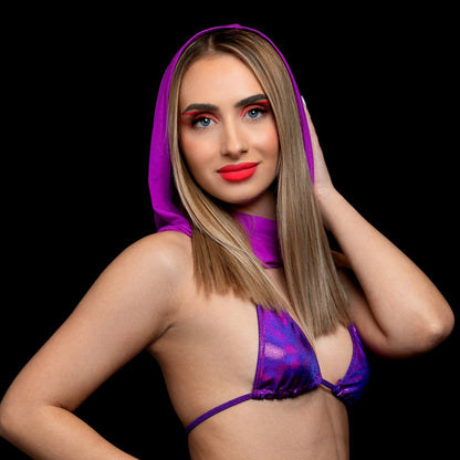 Confident woman models the Brigitewear International, LLC Grape Babe Mesh Hood – Rave Festival in purple bikini style, posing boldly against a black background.