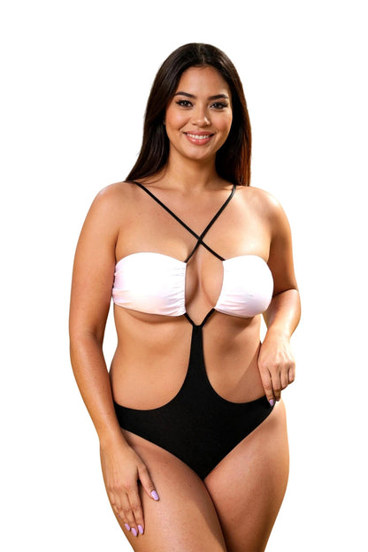 A woman smiles in a Brigitewear International Dynamic Bandeau 1-Piece Thong or Rio swimsuit, featuring a stylish black and white cutout design against a white background.