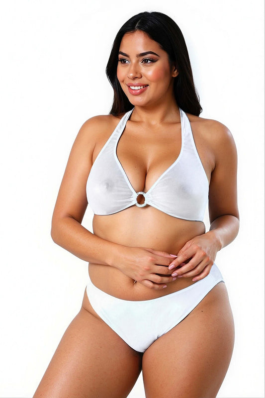A woman smiles in the Brigitewear International, LLC Ecstasy Bikini Top, featuring a white halter style with ring detail, against a white background.