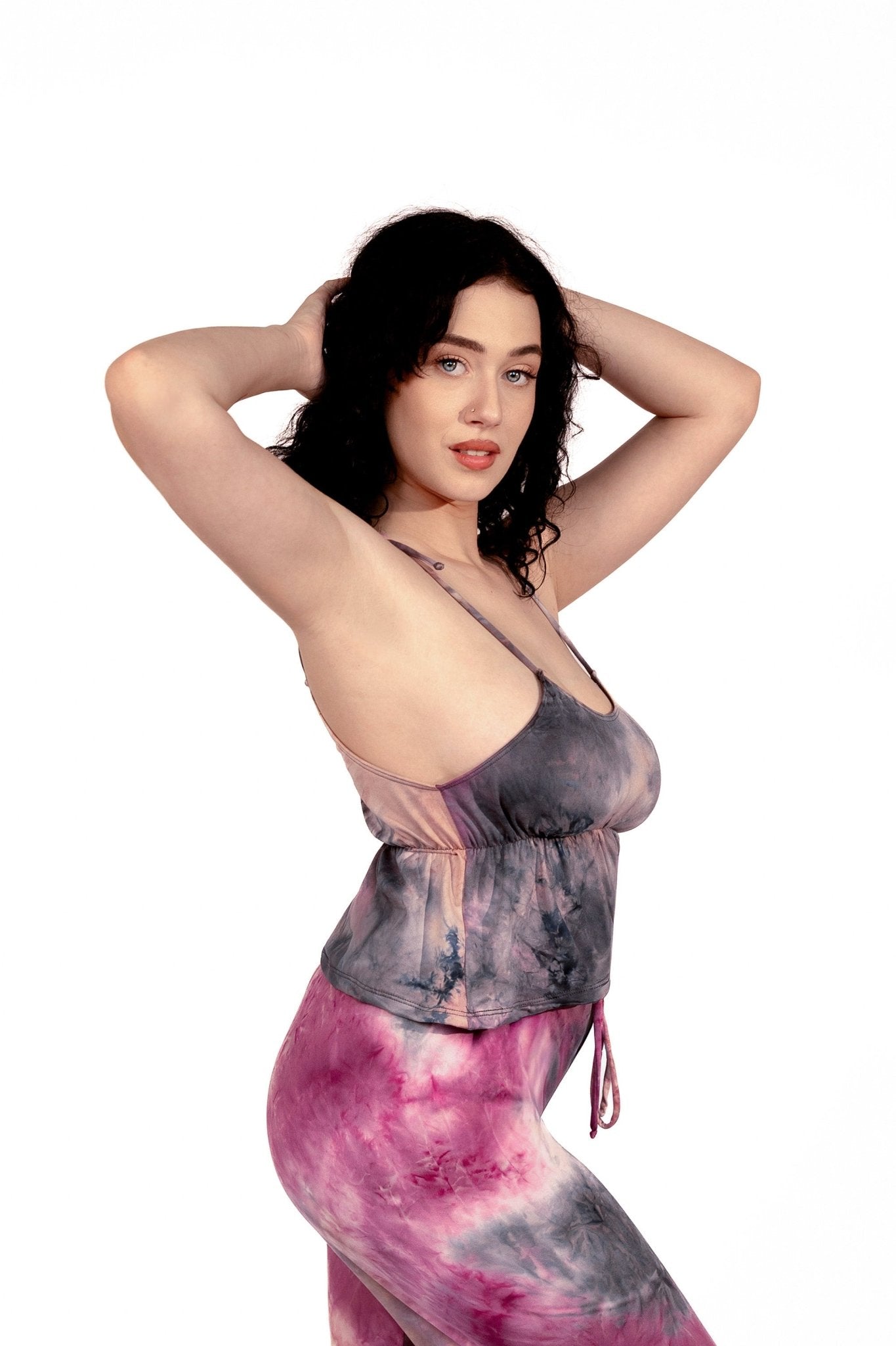 Woman with curly dark hair poses in Brigitewear International, LLC Long Loungewear Pants-Soft&Cozy and a tie-dye tank top against a white background.