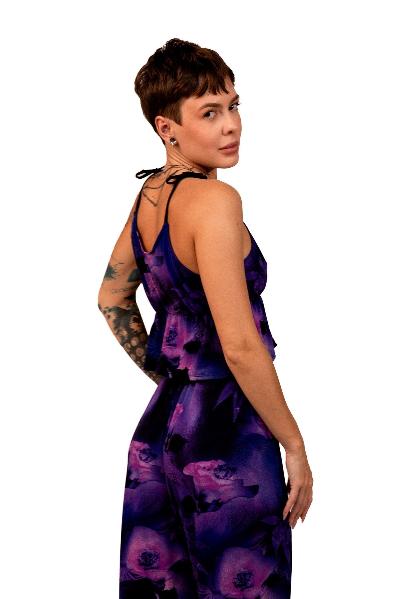 A person wearing Brigitewear International, LLC's Long Loungewear Top-Soft & Cozy stands against a white background, sporting short hair and looking over their shoulder.