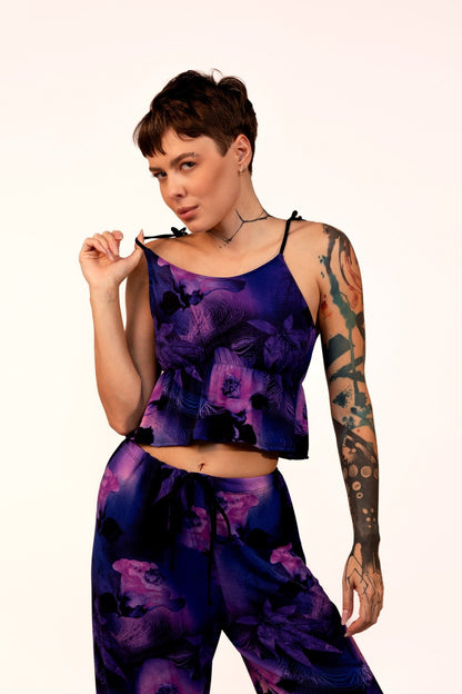 Woman wearing the Brigitewear International Long Loungewear Top-Soft & Cozy, with short hair and tattoos, poses against a plain background.