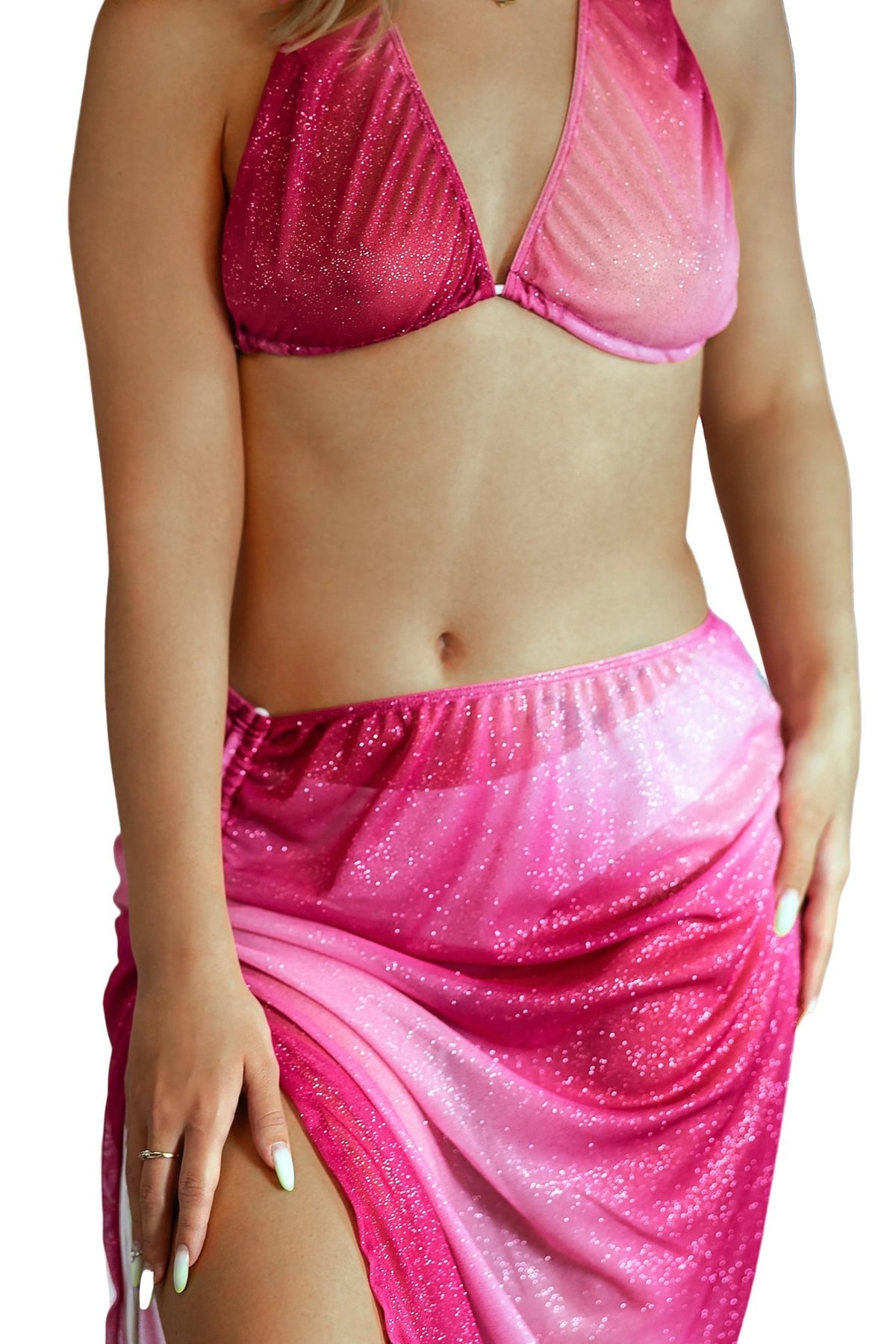 A woman models the Brigitewear International, LLC Pink Sparkle Ombre Tear Drop Halter Top and a matching skirt, posing with one hand resting on her thigh.