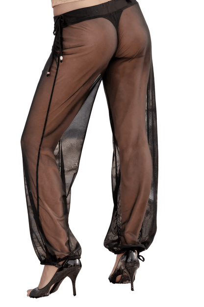 Model wearing Brigitewear International, LLC’s Sheer Mesh Pants – Beach Cover-Up Trousers with black heels, photographed from the back against a white background.