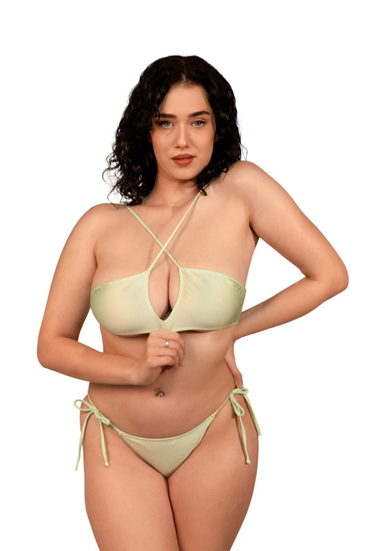 A woman with curly dark hair models the Teardrop Bikini Top by Brigitewear International