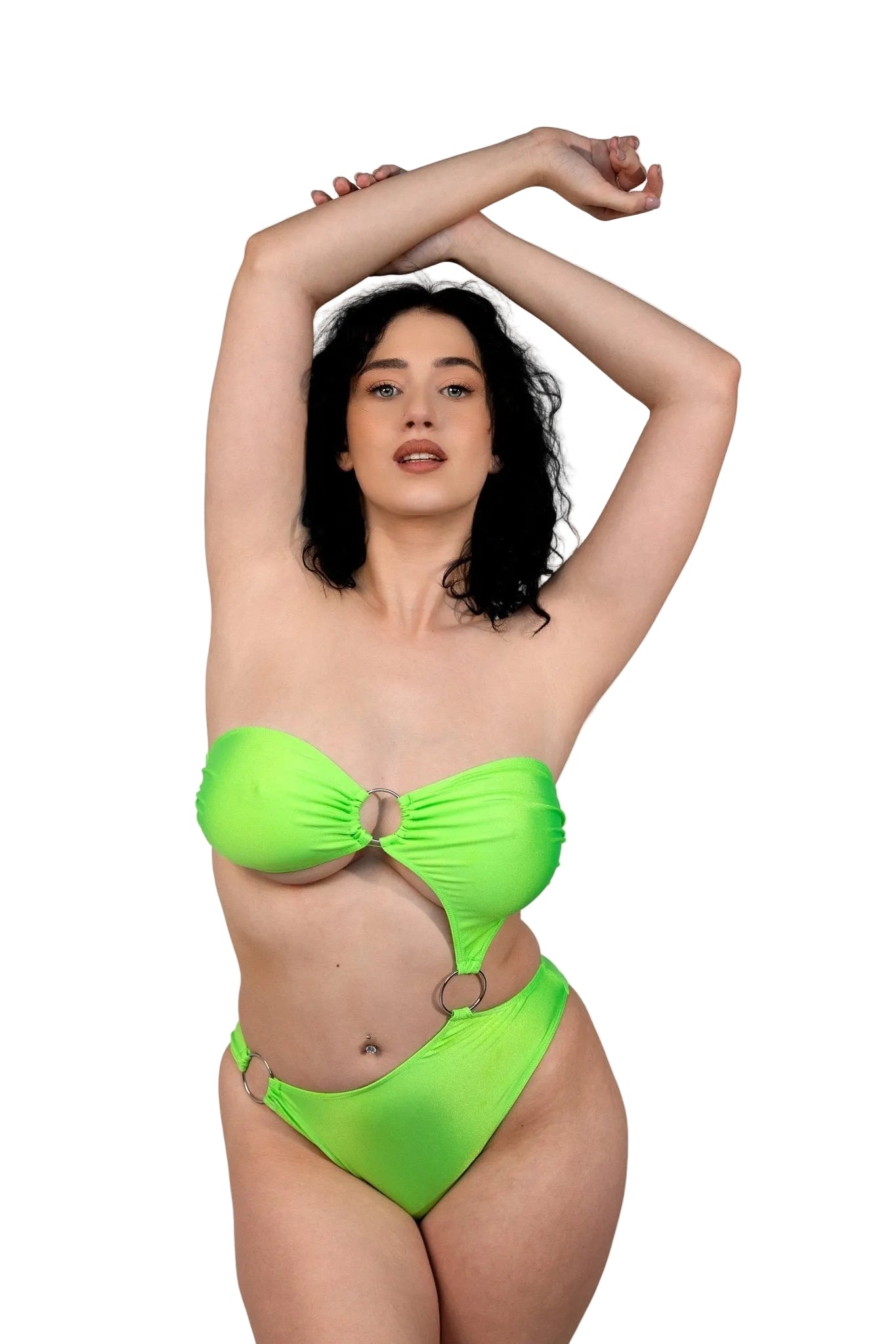 A woman in the Tri-Ring Rio Swimsuit by Brigitewear International, LLC poses with arms raised against a plain white background.