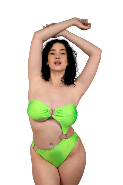 A woman in the Tri-Ring Rio Swimsuit by Brigitewear International, LLC poses with arms raised against a plain white background.