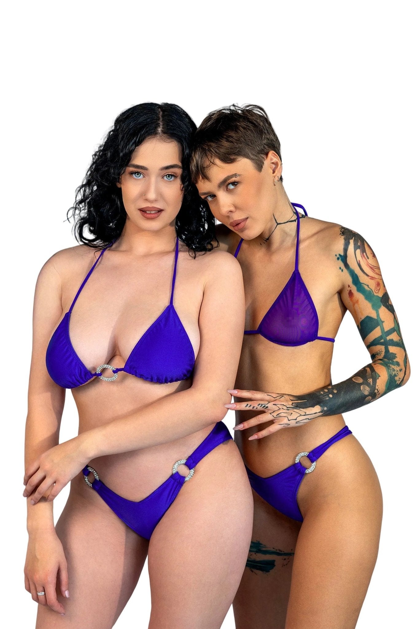 Two women wear matching Brigitewear V-Bottom Thong & Rio Bikini Bottoms, posing together against a plain light gray background.