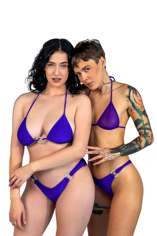 Two women wear matching Brigitewear V-Bottom Thong & Rio Bikini Bottoms, posing together against a plain light gray background.