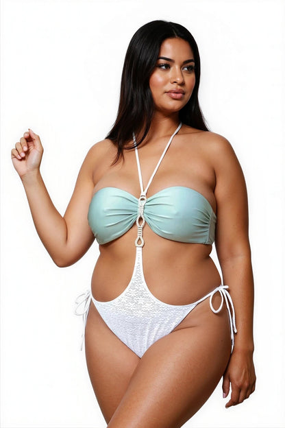 Woman wearing the Vintage Bandeau Top by Brigitewear International, LLC, a light green and white one-piece swimsuit with halter straps, posing against a white background.