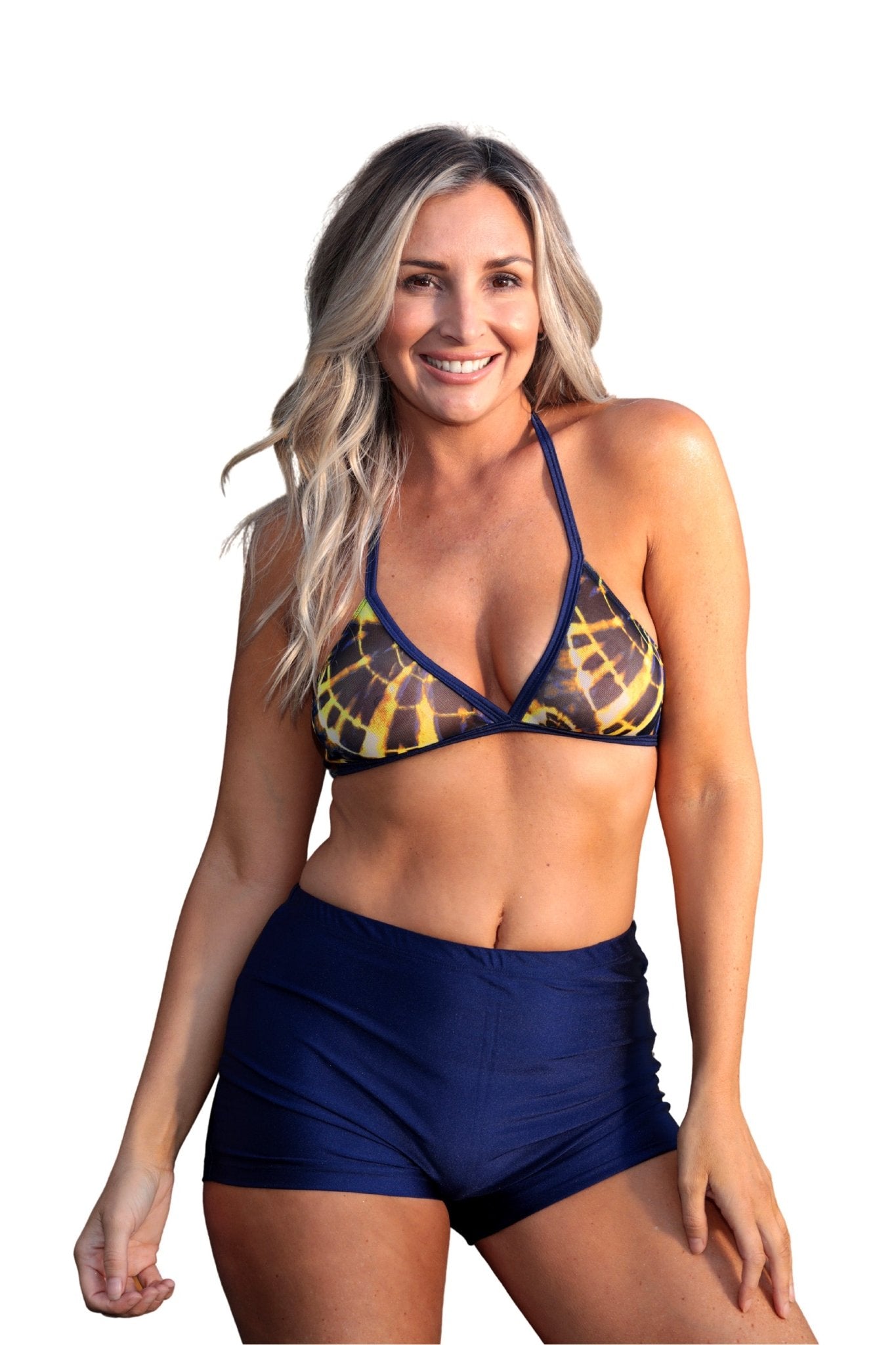 A smiling woman models Brigitewear International, LLC Women's Swim Shorts with a blue and yellow bikini top, posing against a white background.