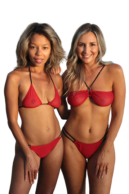 Two women wearing red bikinis on a white background